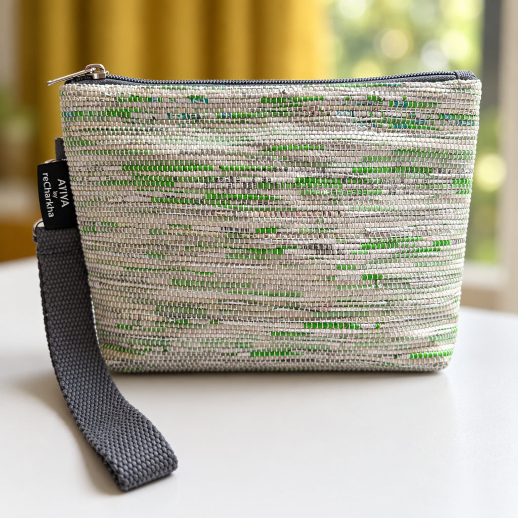 Upcycled handwoven Wrist-it bag in shades of green & white with a grey trim.