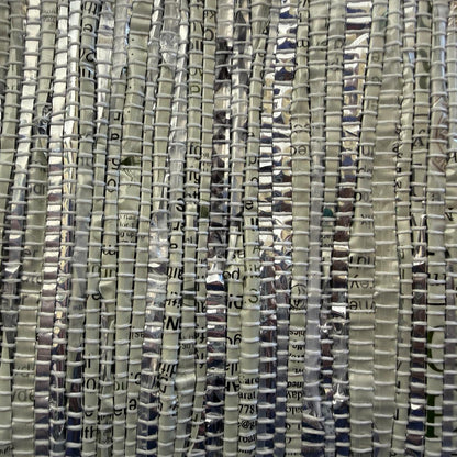 Close-up of hand-woven collapsible storage basket small in silver & grey.