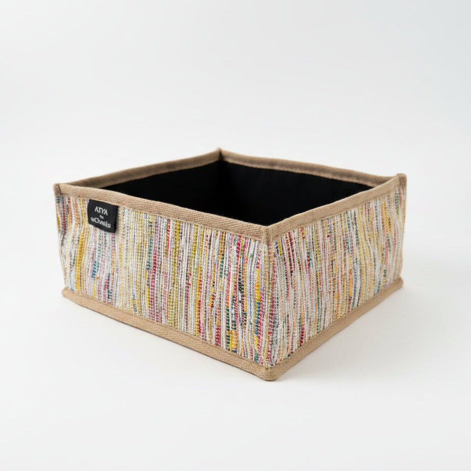 Upcycled handwoven collapsible storage box small in multicolored weave and beige trim.