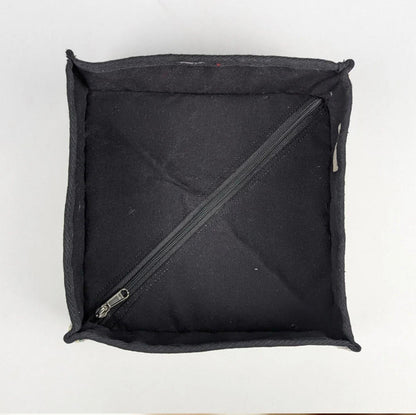 Inside view of the upcycled handwoven storage basket with a zipper to collapse the box when not in use.