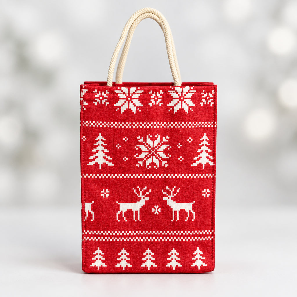 Fabric Gift Bag Small in a red holiday Nordic print with pine trees, snowflakes, and reindeers.