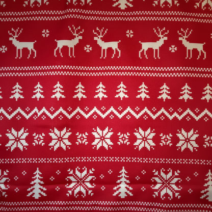 Red fabric with white Christmas-themed pattern including reindeer, trees, and snowflakes.