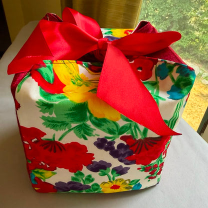 Red & white floral fabric gift box with a red ribbon closure in 7X7X7 square size.