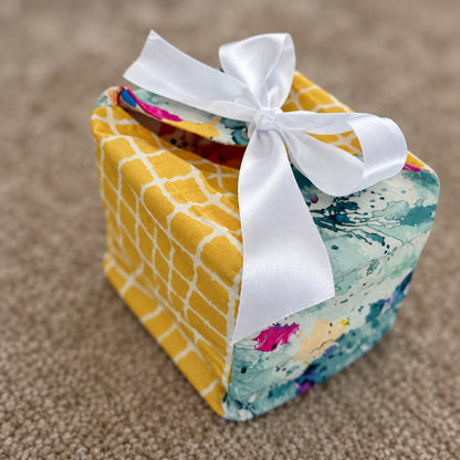 Fabric Gift Box in a yellow checks and abstract print with a white ribbon closure in 7X7X7 inch size.