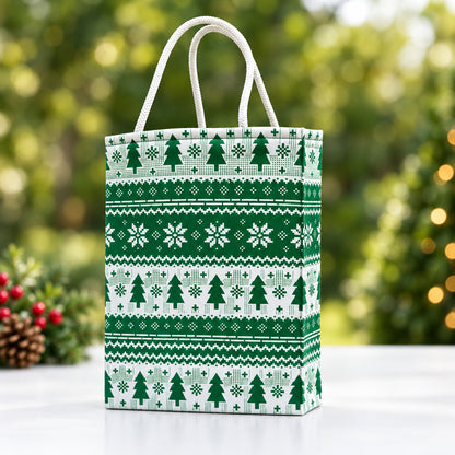 Fabric Gift Bag Small in a green holiday print with pine trees and snowflakes.