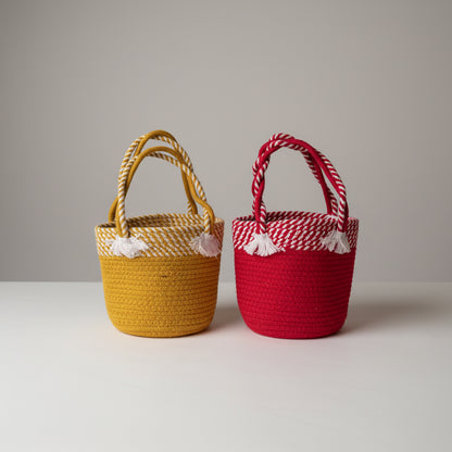 Two rope woven baskets, one red and one yellow.