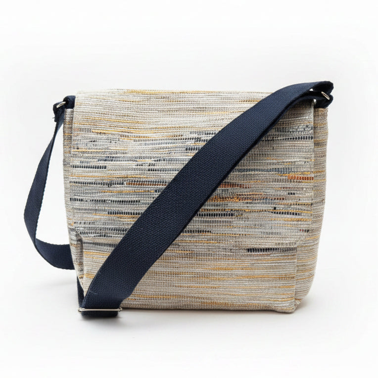 Upcycled handwoven Messenger Bag in navy blue and gold weave with a navy blue strap.