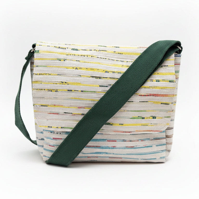 Upcycled handwoven Messenger Bag in multicolored weave with a dark green strap.