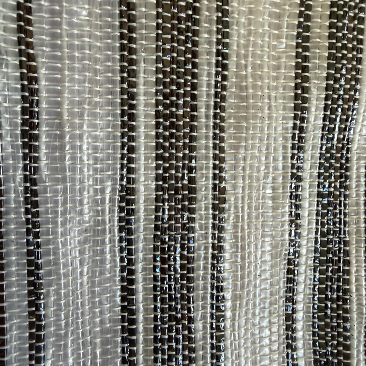 Close-up of upcycled handwoven Messenger Bag in a dark brown and white striped weave and a dark brown strap.