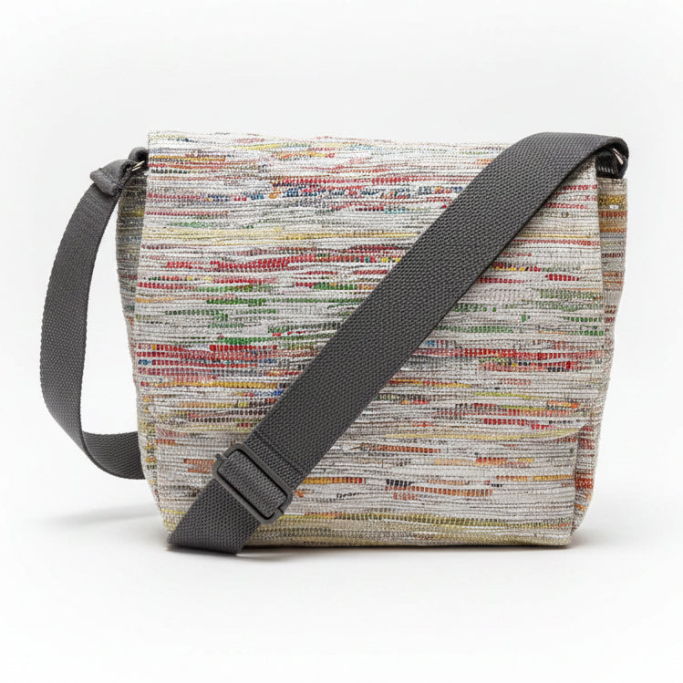 Upcycled handwoven Messenger Bag in multicolored weave with a grey strap.
