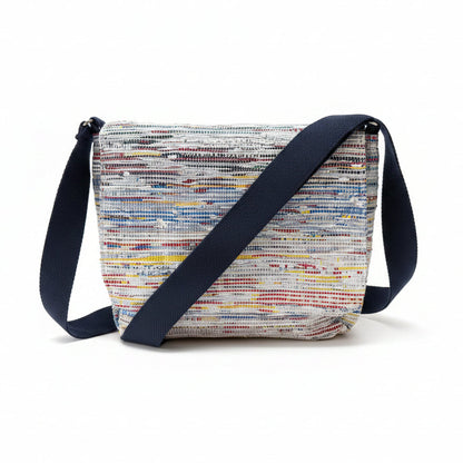Upcycled handwoven Messenger Bag in multicolored weave with a navy blue strap.