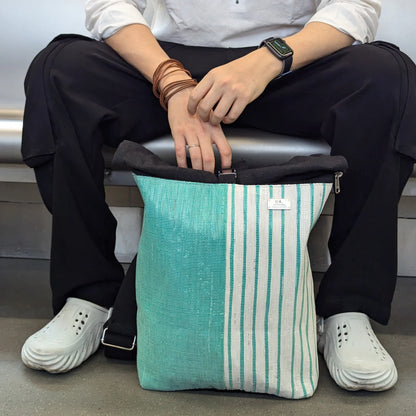 Lifestyle image of model with an Upcycled Spartan Backpack