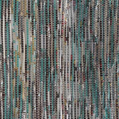 Close-up of upcycled handwoven Sling-It Bag in a teal weave with a black strap.