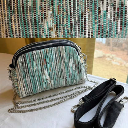 Taco Sling bag in teal & white weave with a chain, plus black strap.